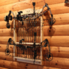 394003 REALTREE 2-Bow 12-Arrow Wall Rack E Wooden crossbow display rack installed on wall with storage 10 arrows.