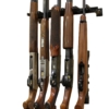 Five long guns organized on a wall-mounted rifle storage rack.
